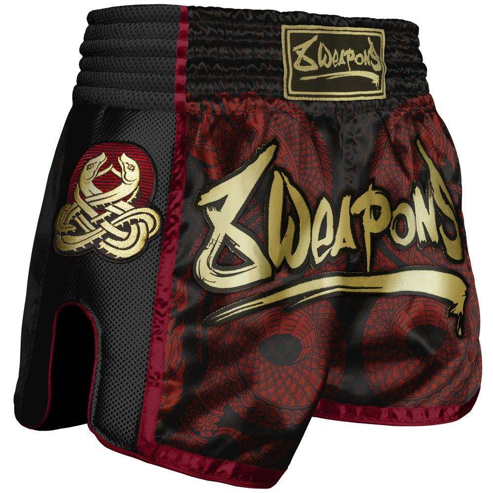 Short de Muay Thaï noir et rouge avec motif Sak Yant Naga, confort et liberté de mouvement.