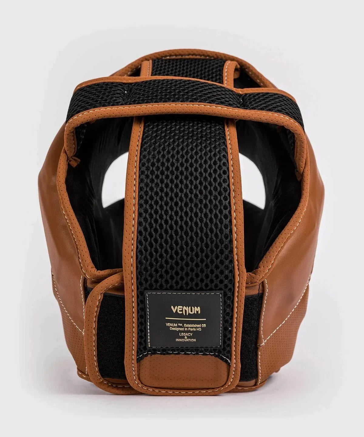Vintage brown and black Venum Impact Evo boxing headgear with breathable lining and adjustable Velcro strap for premium protection and style