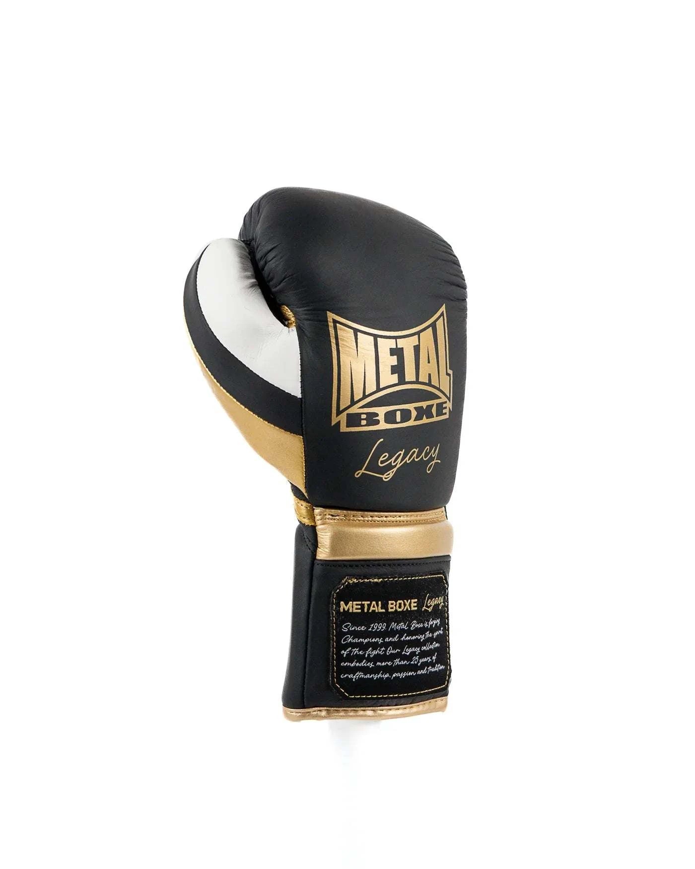 Black Metal Boxe Legacy boxing glove with gold and white accents, lace-up closure, and premium leather design for training and sparring.