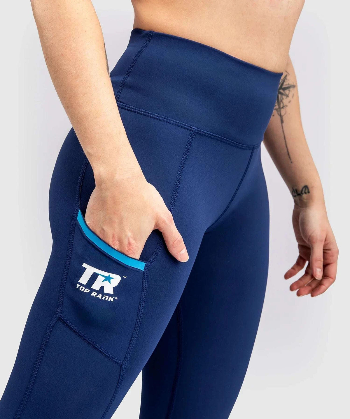 Navy blue high-waisted compressive leggings with side pocket and Top Rank logo for women