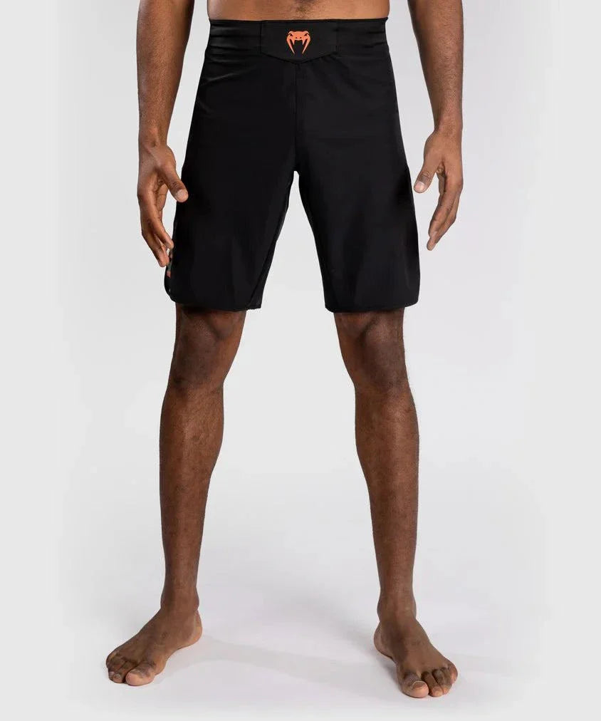 Black Fightshort Venum Jungle Ops with orange logo and ergonomic fit for MMA and grappling training