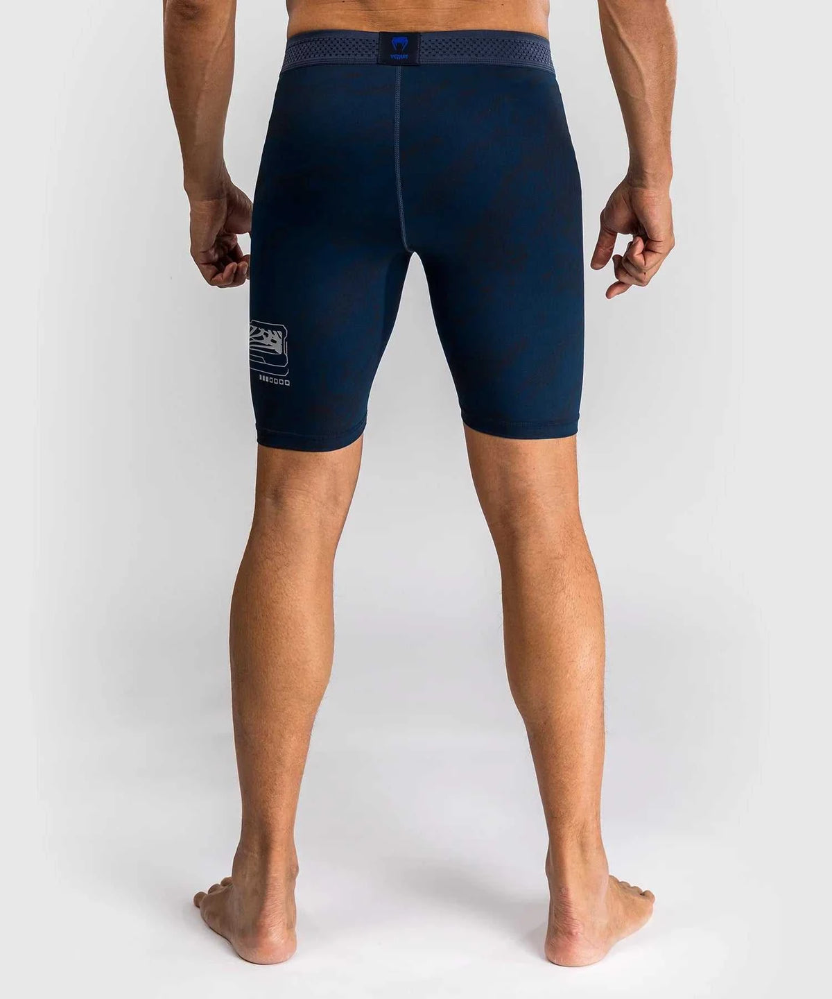 Back view of navy blue compression shorts from UFC Fusion par Venum collection designed for MMA training and performance