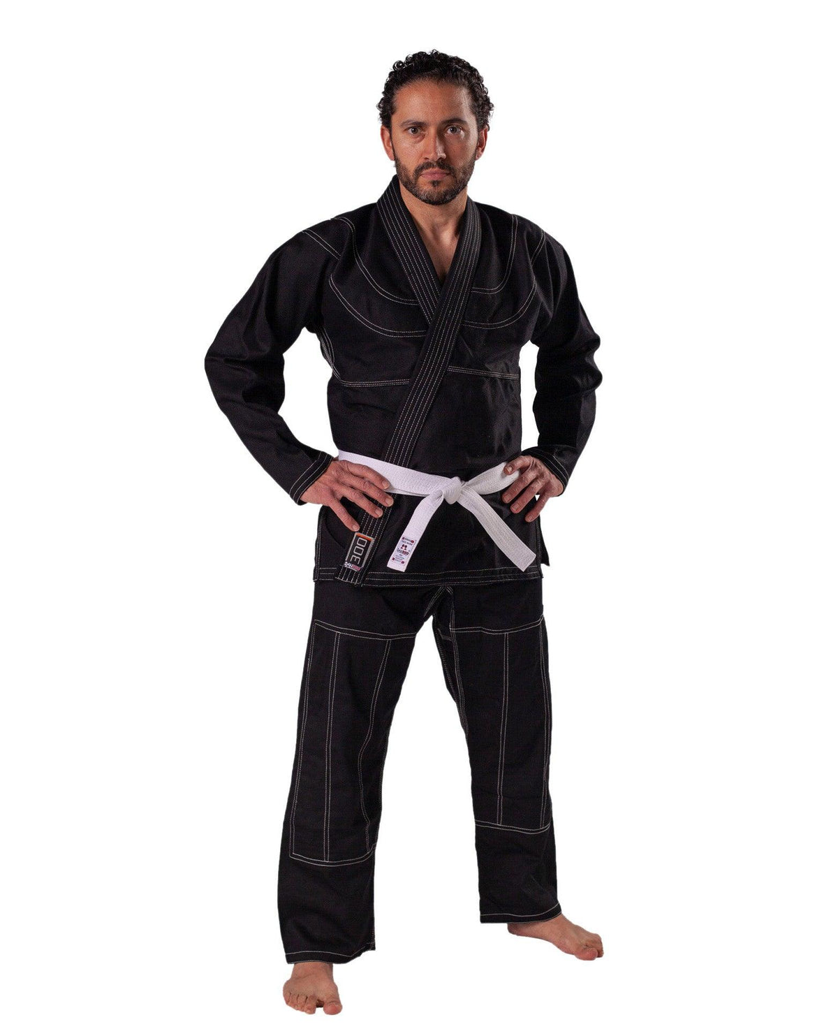 Man wearing black DANRHO Kimono Brazilian Jiu Jitsu gi with white belt and reinforced stitching