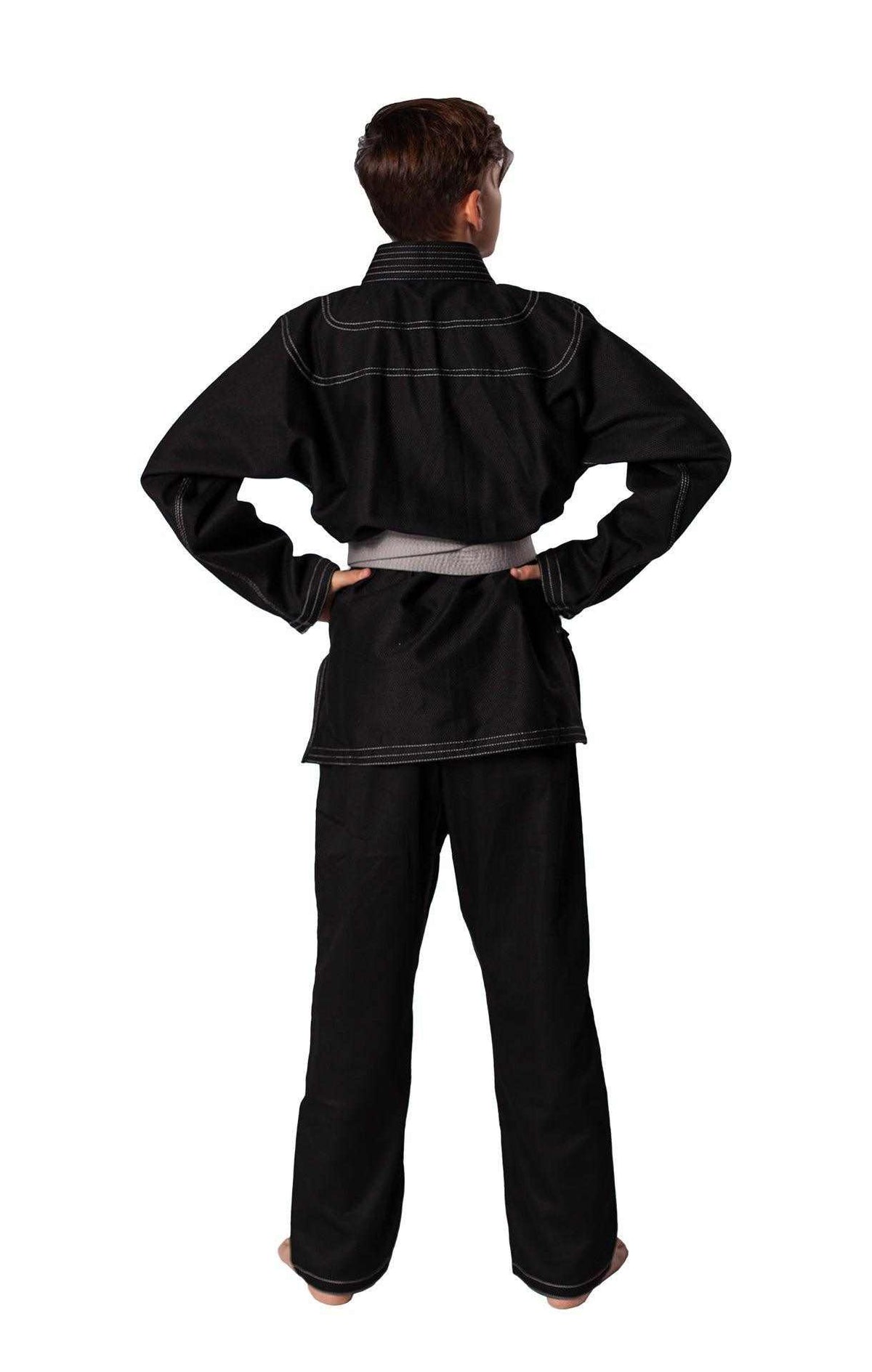 Child wearing black Danrho Brazilian Jiu Jitsu kimono from the back