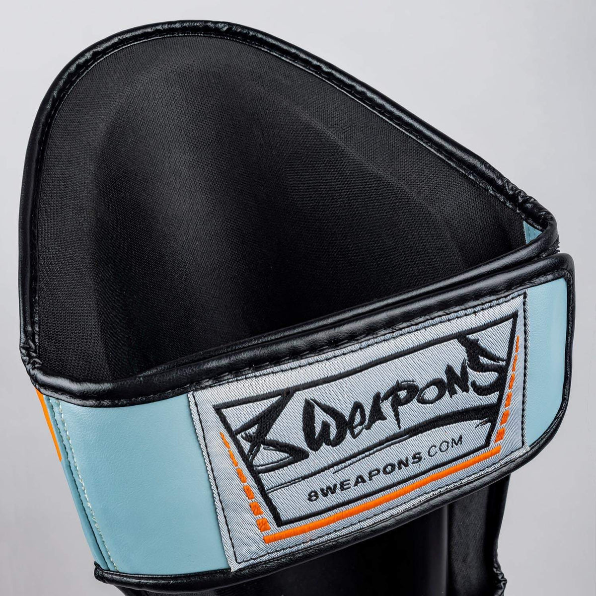 Protège-tibias 8 WEAPONS Shift gris glacé et orange design ergonomique sport combat