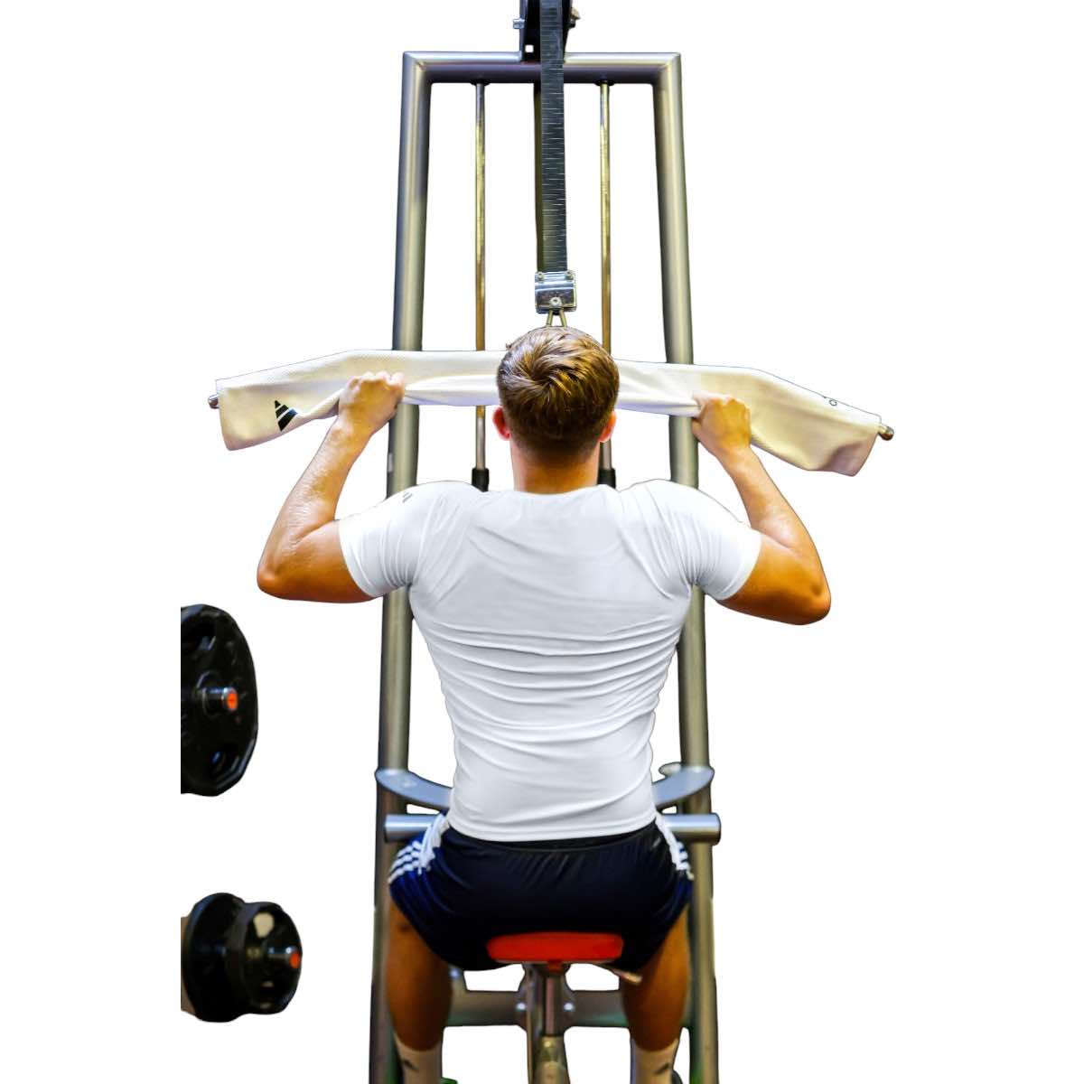 Man wearing white Rashguard adidas performing pull-down exercise on gym machine
