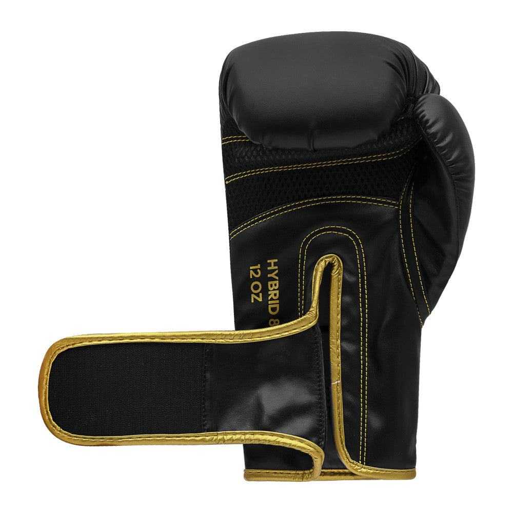 Black and gold Adidas Hybrid 80 boxing glove with durable PU material and secure velcro strap, size 12oz