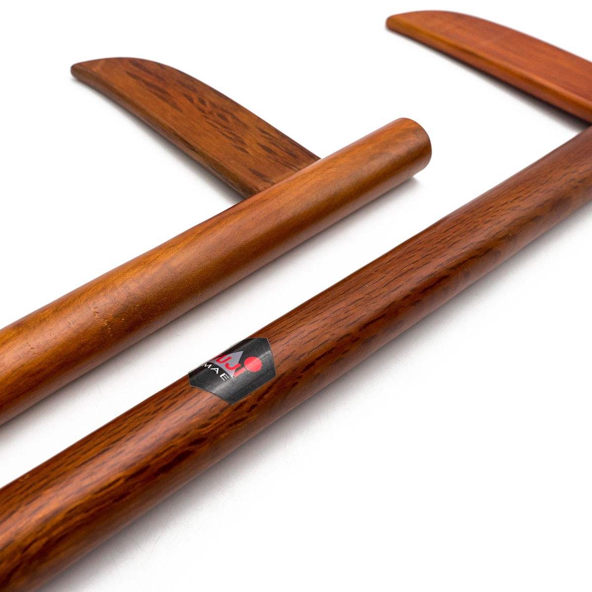 Pair of red oak wooden training Kamas for martial arts practice with polished finish and ergonomic design