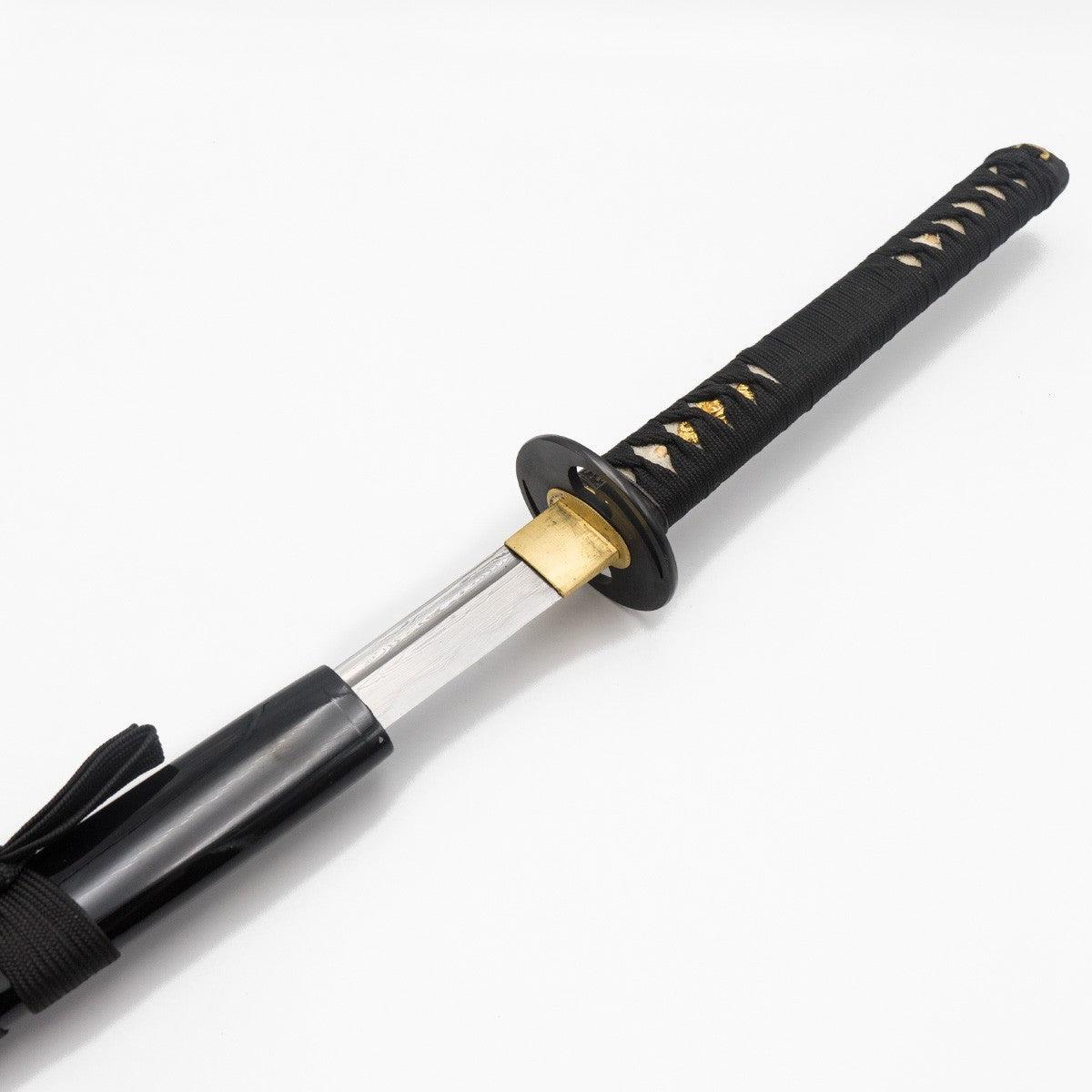 Black-handled katana with Damascus steel blade partially sheathed in black lacquered wooden saya for martial arts practice