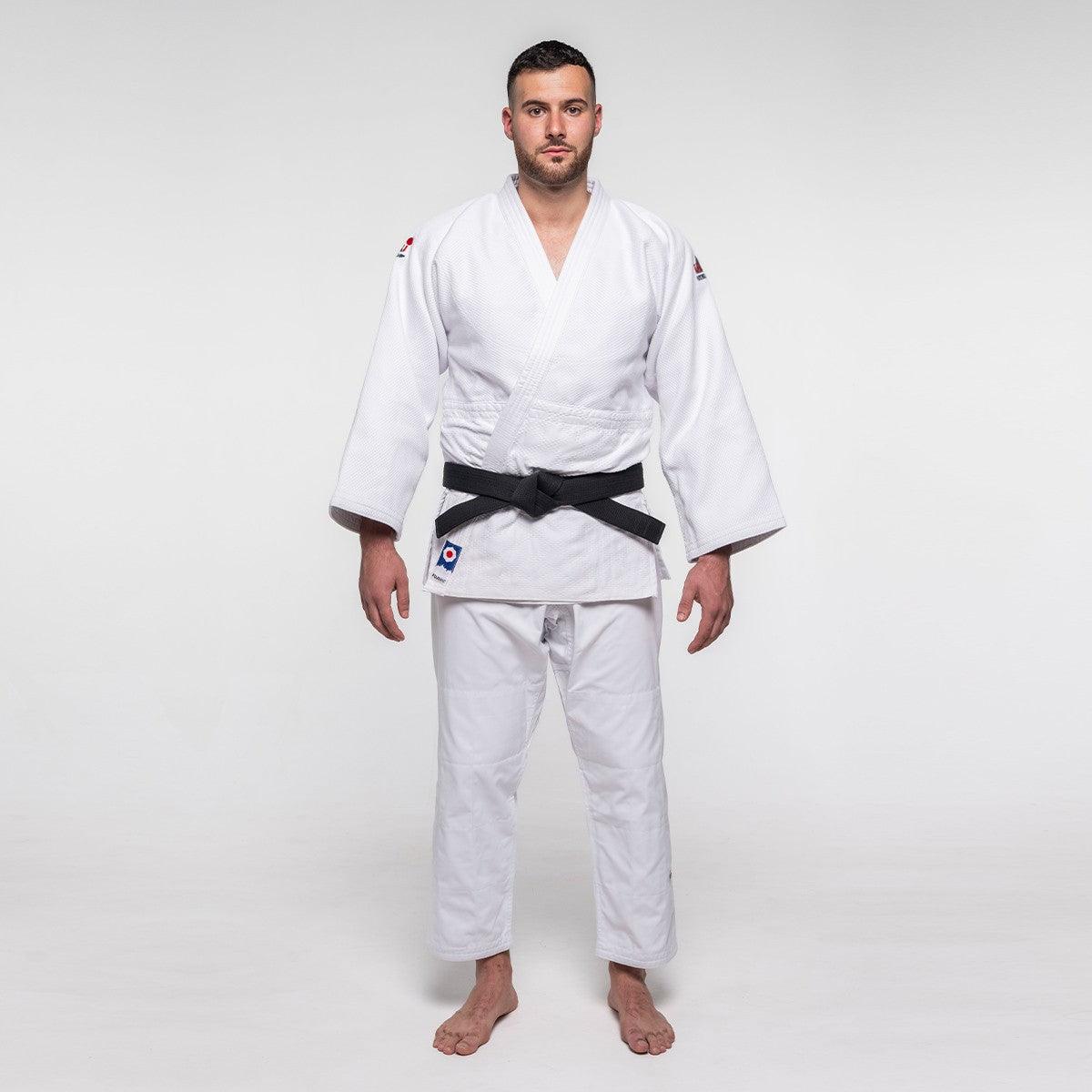 Man wearing white Judo Gi ProWear 2 with black belt standing on plain background