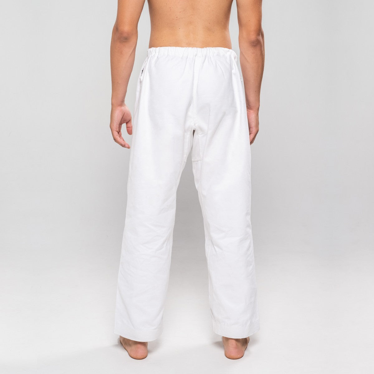 Back view of white Pantalon Karaté Legacy II karate pants made from 100% brushed cotton designed for comfort and durability