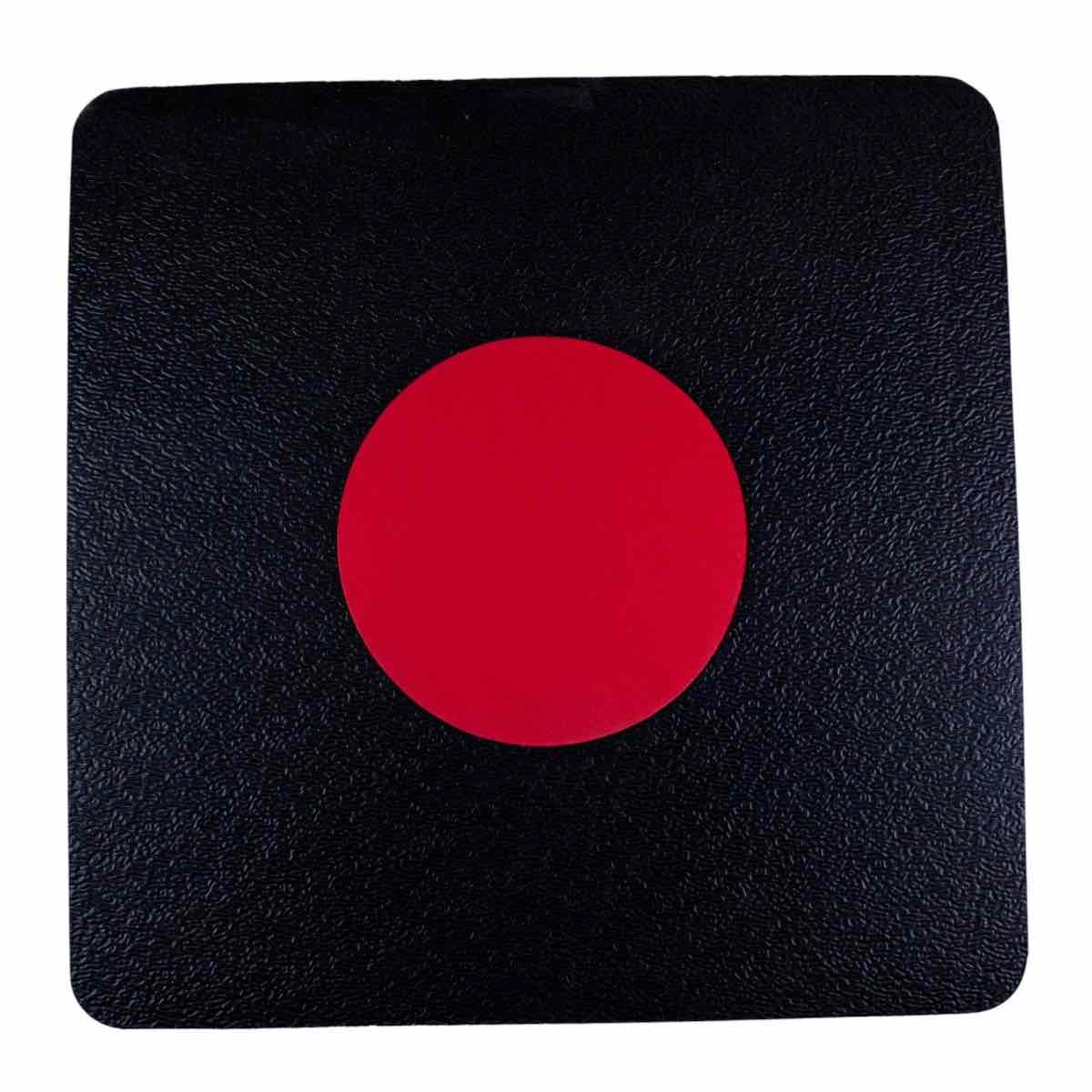 Reusable Kwon breaking board for children with red center target on black textured surface