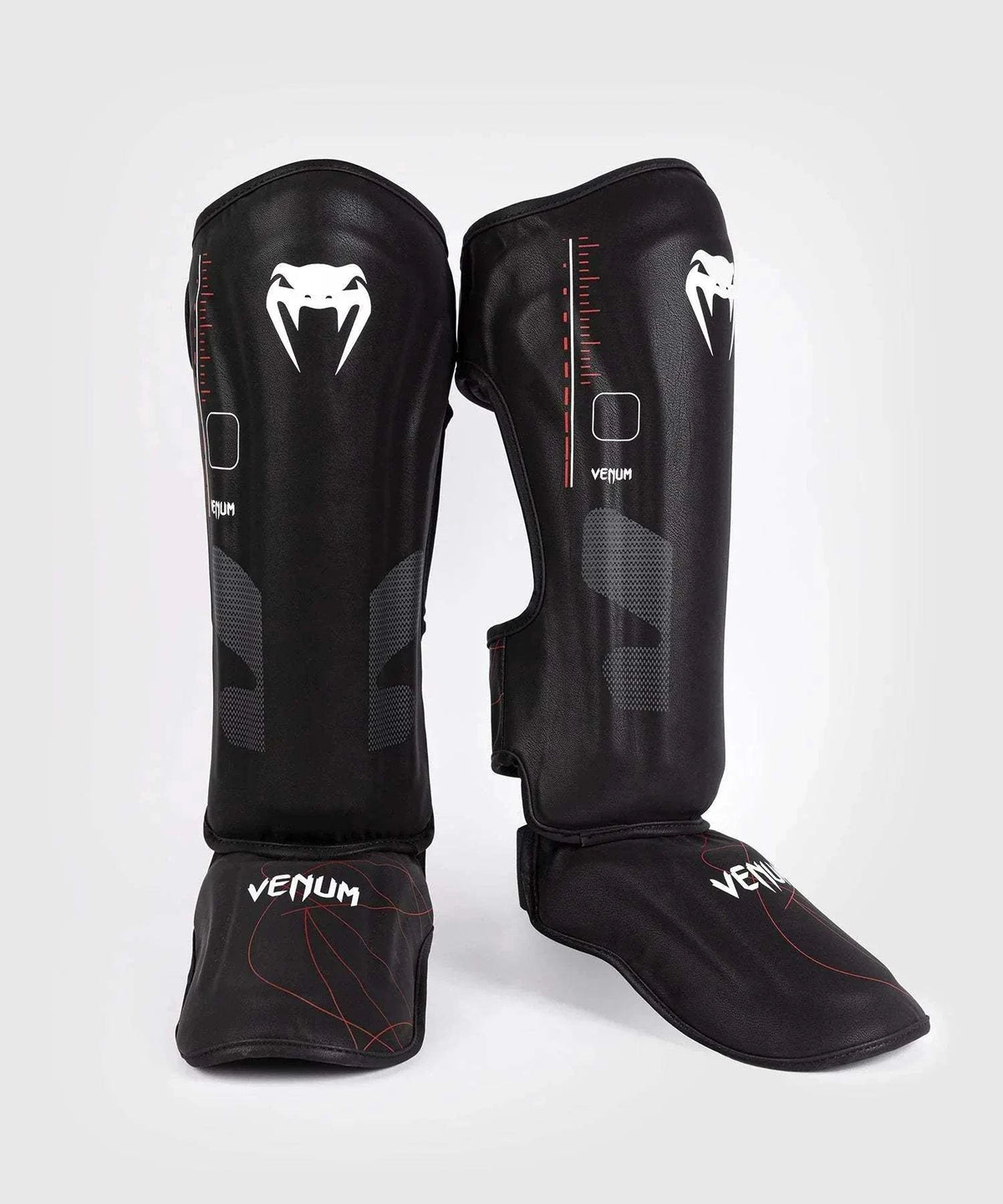 Black and red Venum Tactical XT shin and foot guards with multi-density foam and velcro straps for martial arts protection