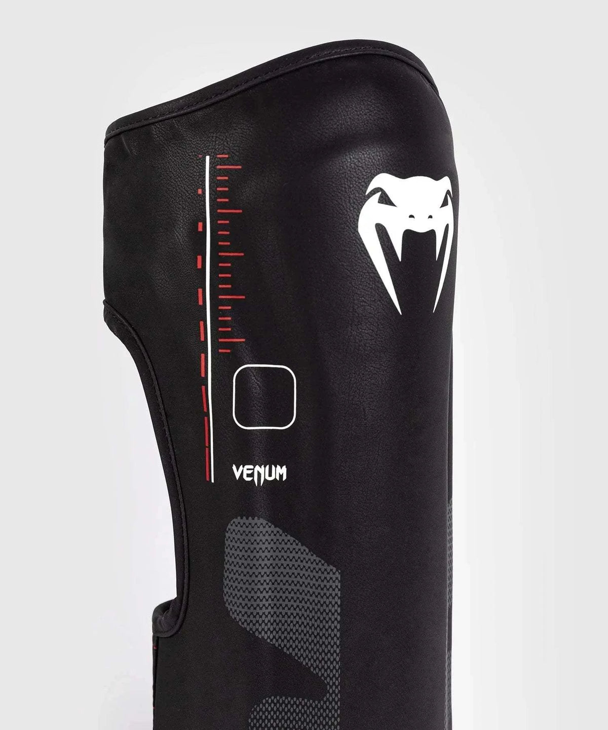 Black and red Venum Tactical XT shin and foot guards with multi-density foam and Velcro straps for MMA and boxing protection