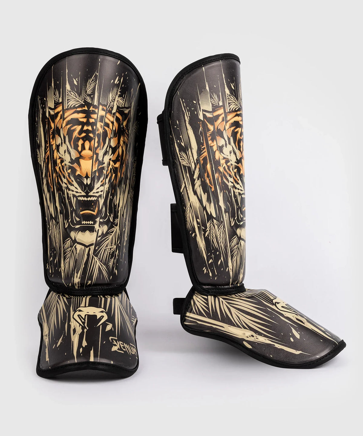 Protège-Tibias Venum Tiger enfant noir et orange néon pour MMA et kickboxing