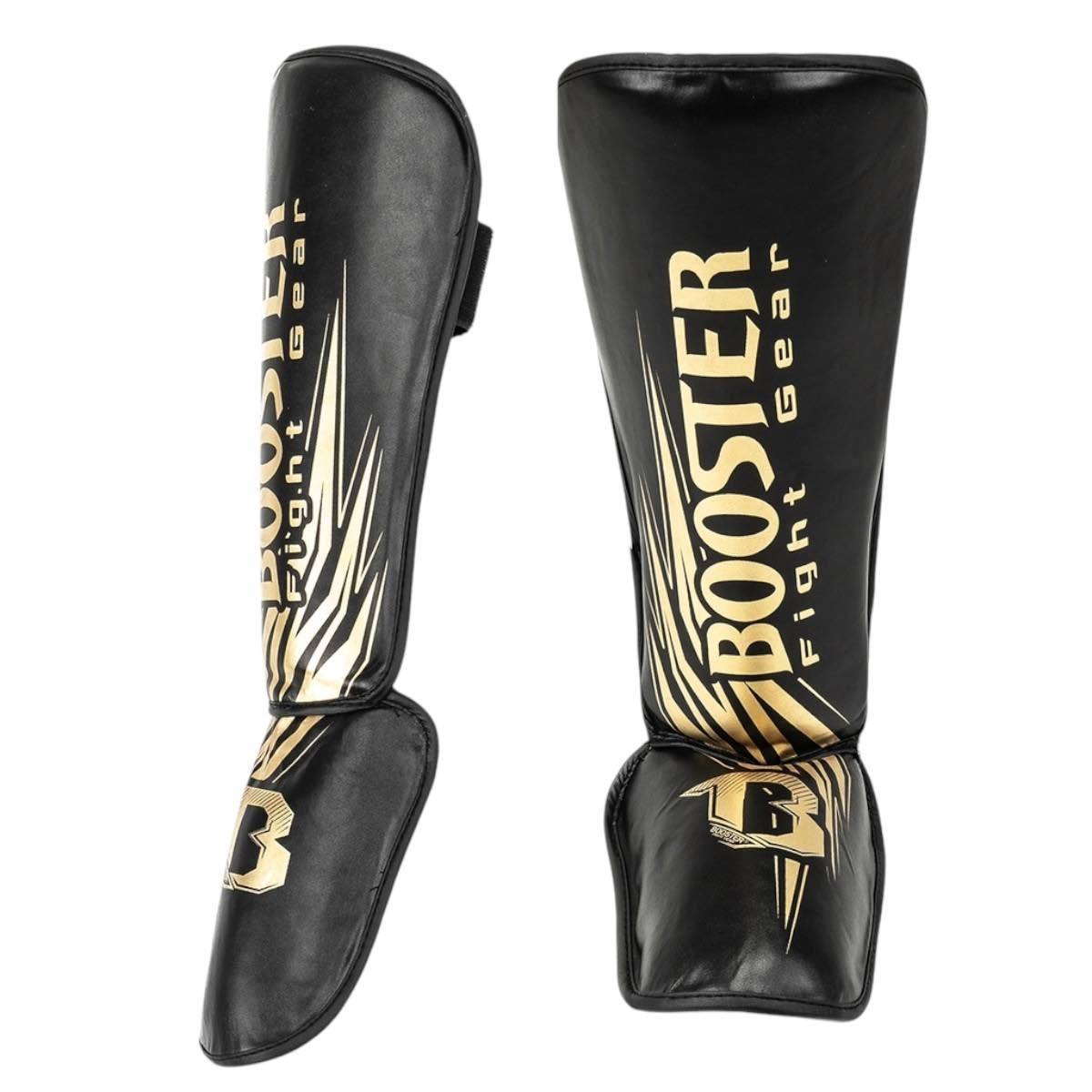 Protège-tibias enfant Booster en cuir synthétique noir ou rose, protection légère et confortable pour boxe et muay thaï.