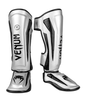 Protège-tibias Venum Elite argent et noir en Skintex haute qualité pour protection pieds-poings