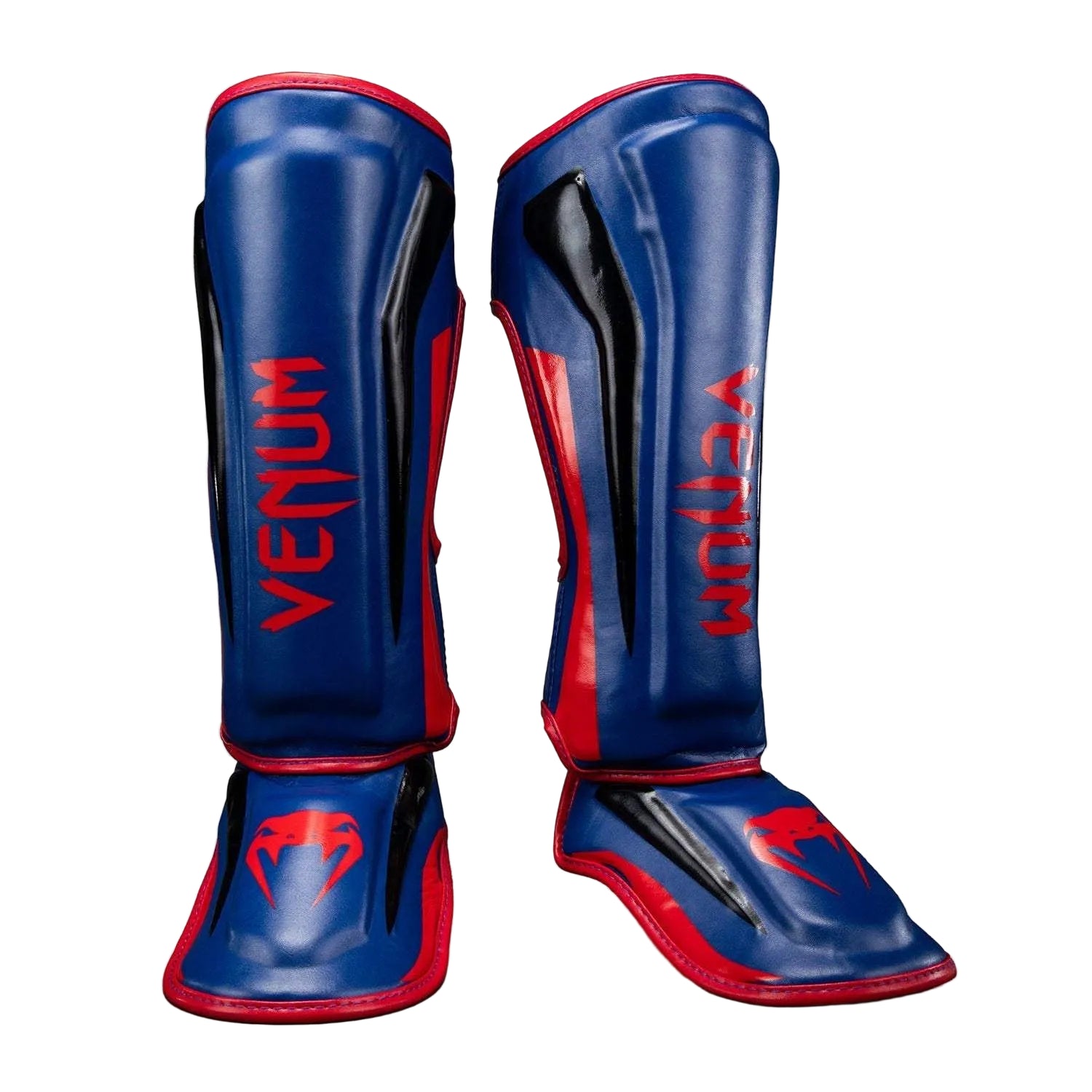Protège-tibias Venum Elite bleu foncé et rouge pour Muay Thaï, kickboxing et MMA, haute absorption des chocs.