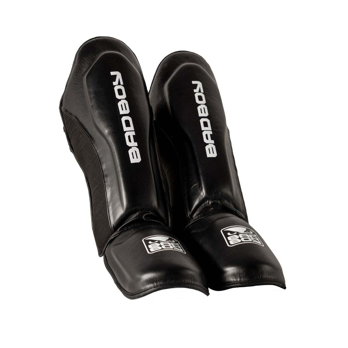 Protège-tibias Muay Thai Bad Boy noir et blanc avec double velcro pour protection optimale et stabilité