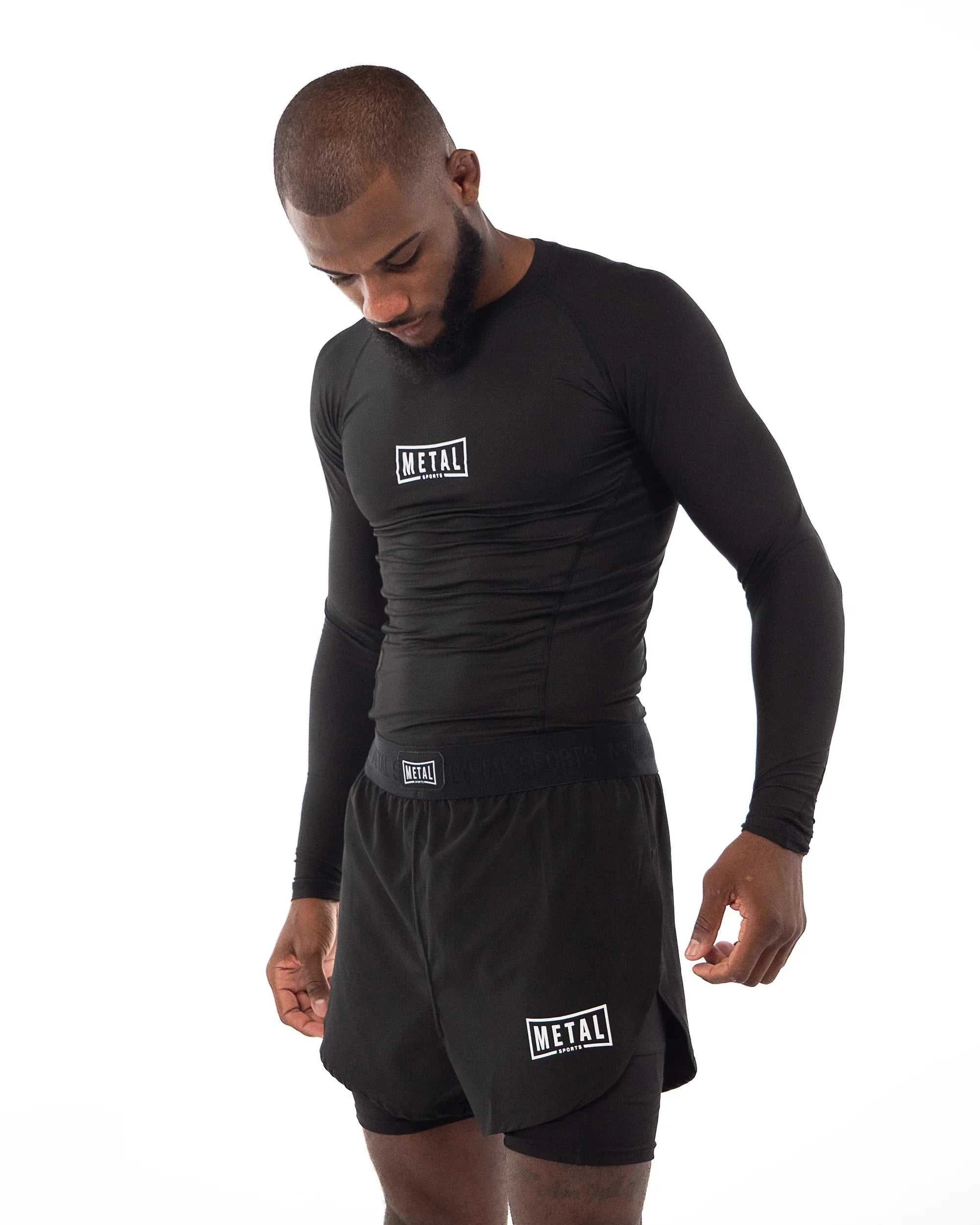 Rashguard Performance Manches Longues noir respirant et ajusté pour MMA et boxe.
