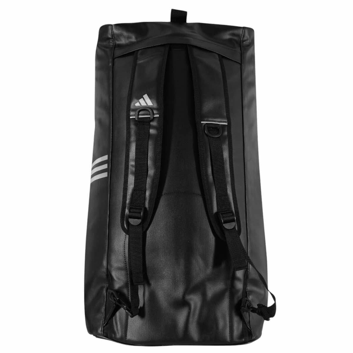 Black Adidas Combat 2-in-1 training bag with adjustable backpack straps and white logo detailing, large capacity and durable PU material.
