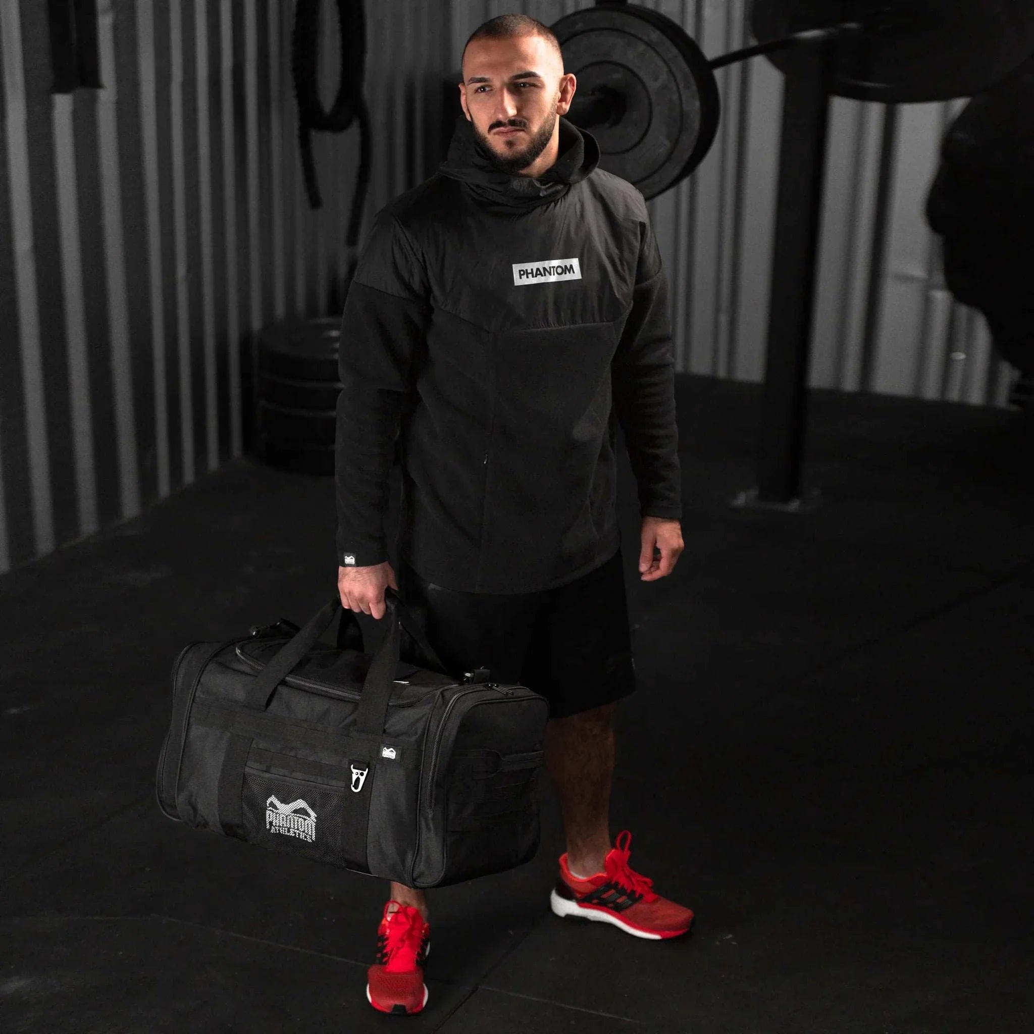 Sac de sport Tactic Phantom Athletics noir en nylon 1000D, 70L, résistant et organisé pour arts martiaux et sports de combat.