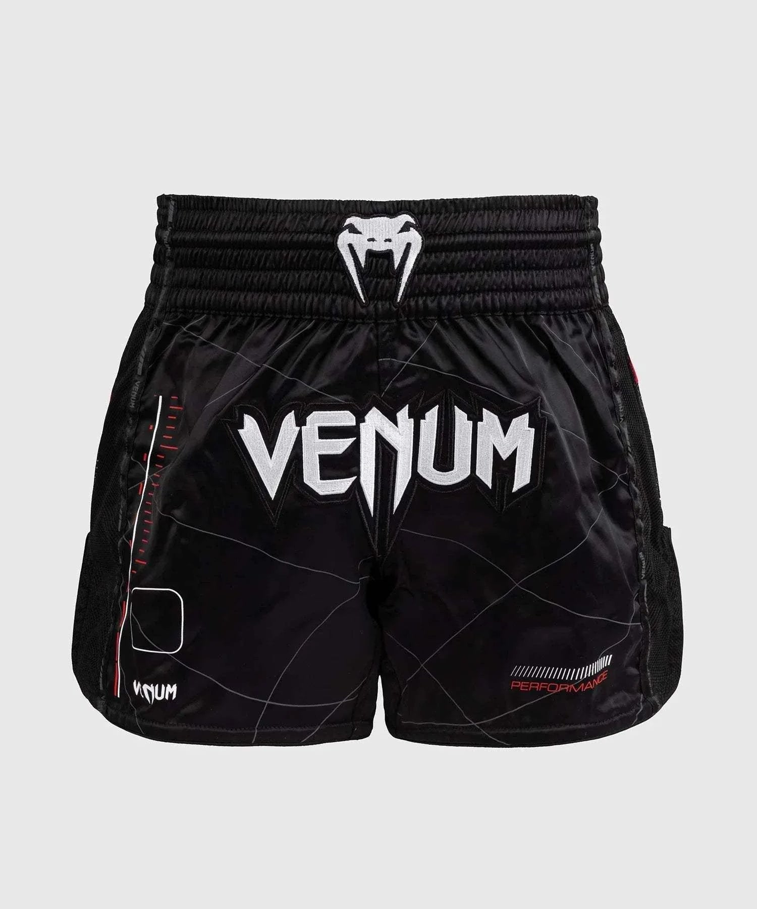 Black and red Venum Tactical XT Muay Thai shorts with logo and elastic waistband for performance and durability