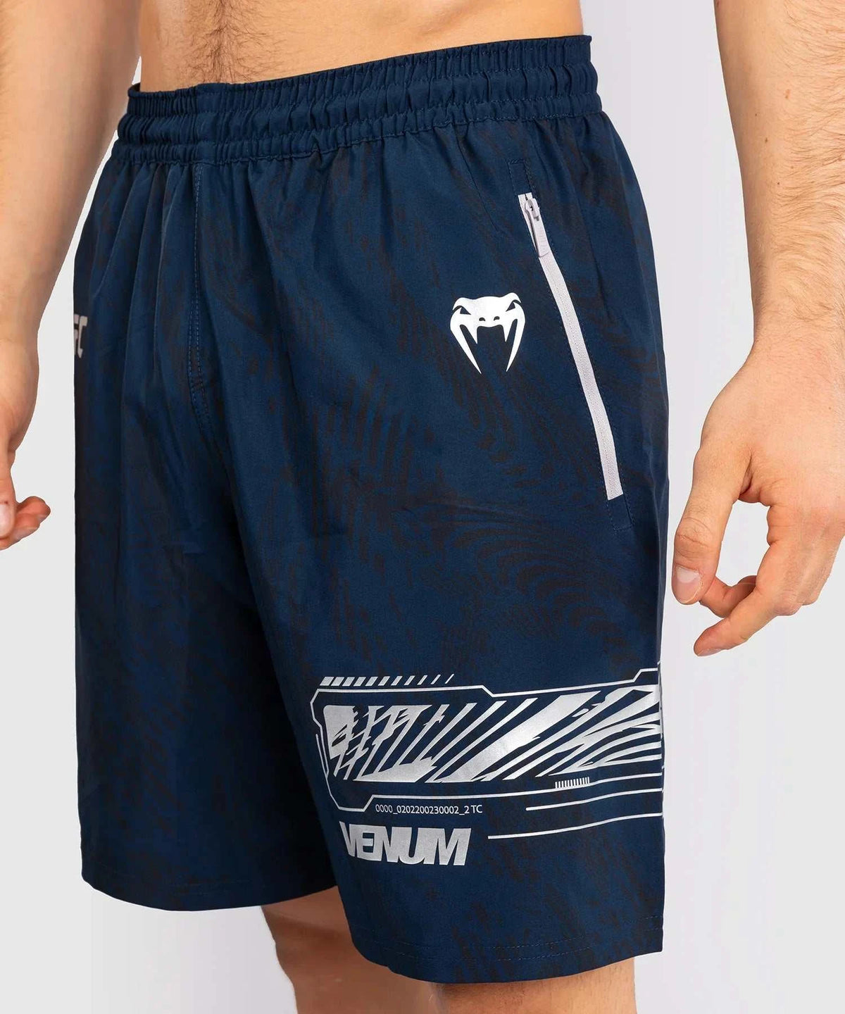 Men's navy blue UFC Fusion performance shorts by Venum with elastic waistband and zippered side pockets