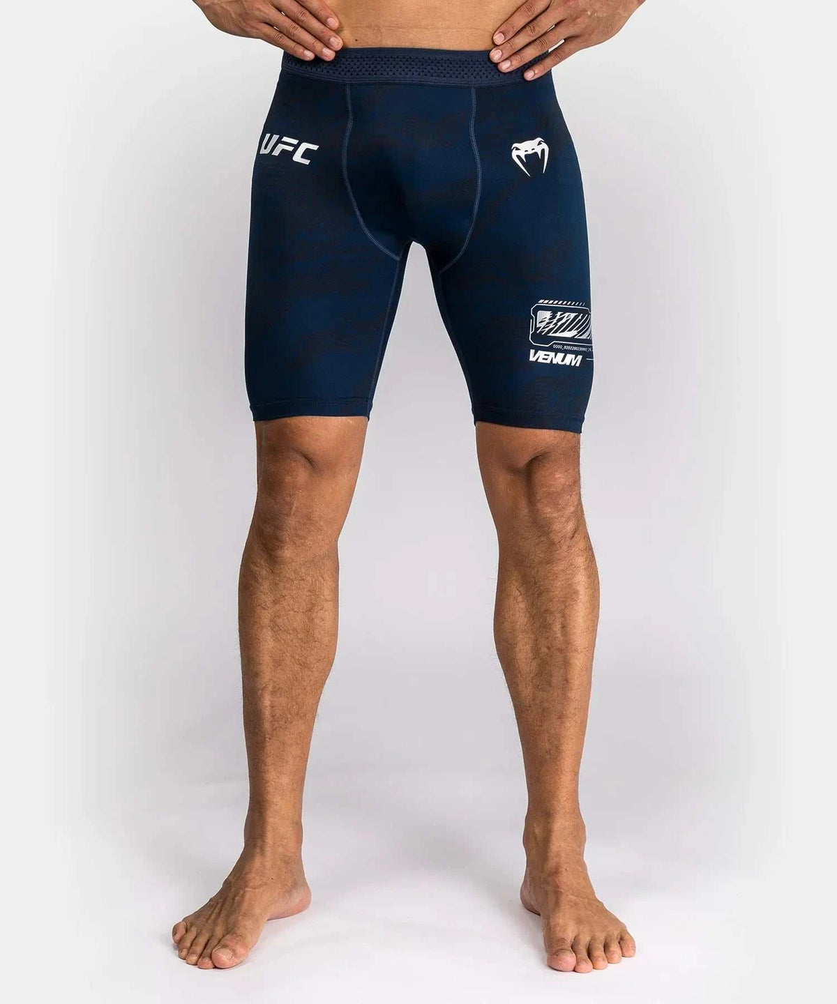 Men's navy blue UFC Fusion par Venum high-performance compression shorts with elastic waistband and reinforced seams.