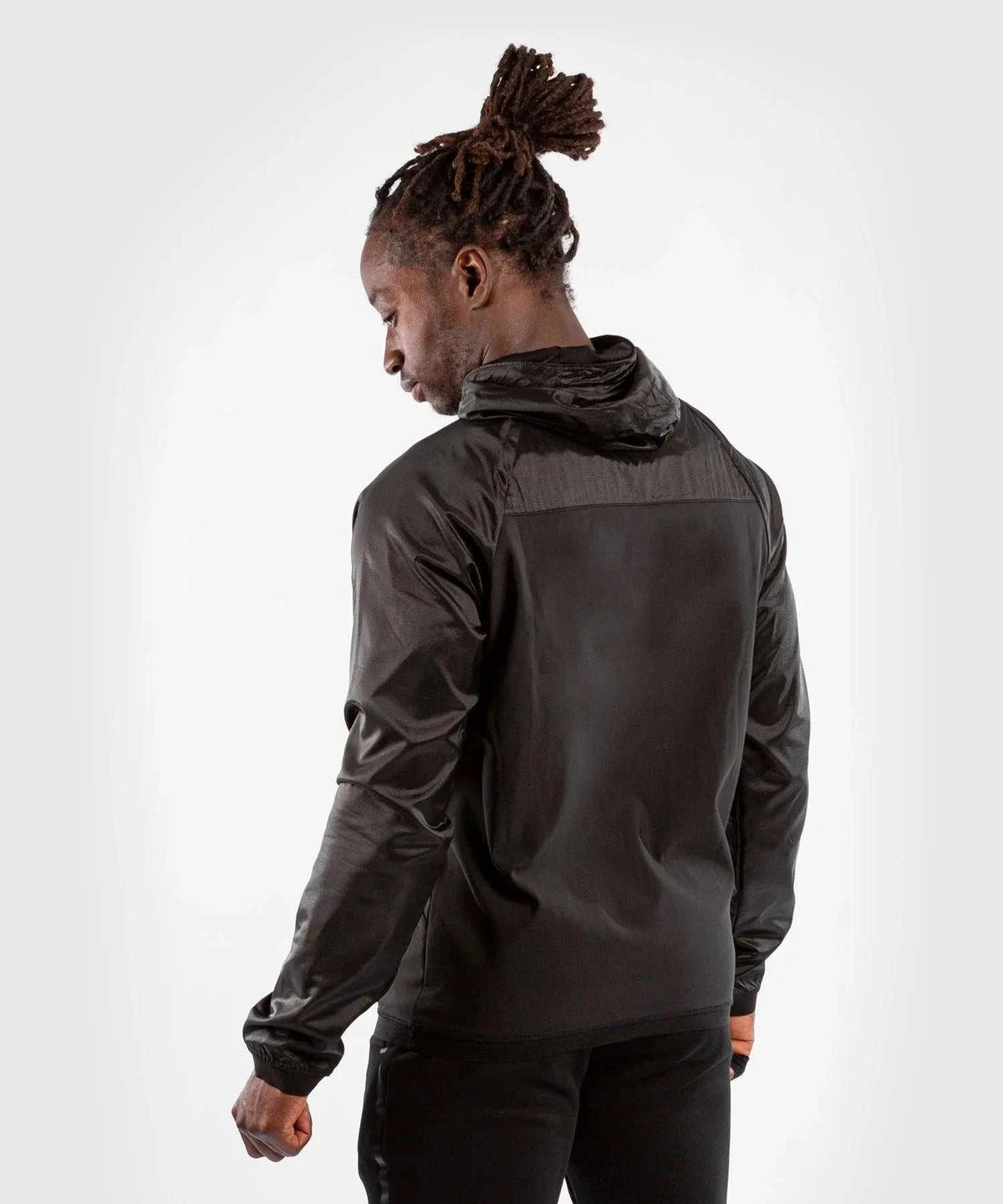 Black Venum Laser XT hoodie with adjustable hood and waterproof fabric worn by male model from back view