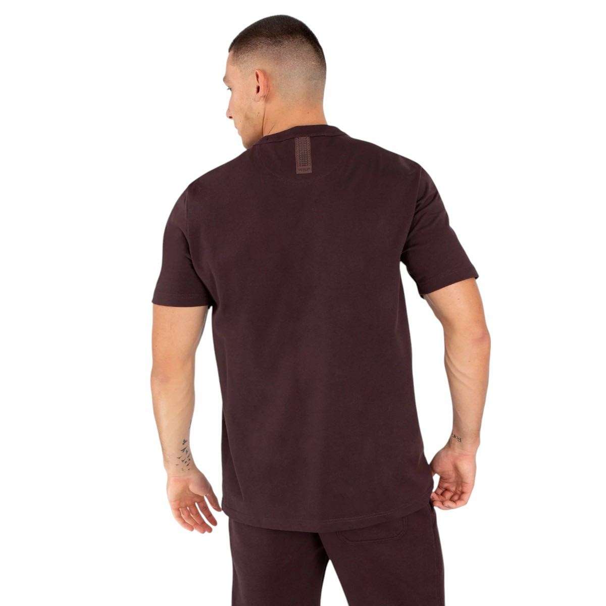 Back view of man wearing brown Venum Silent Power short-sleeve t-shirt with tonal logo on neck and regular fit design