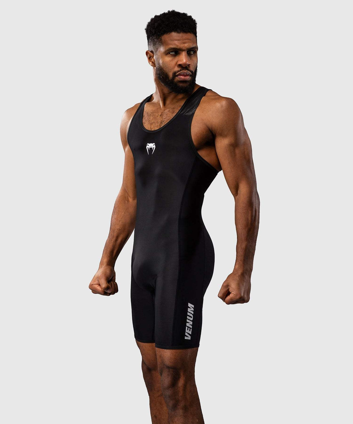 Combinaison de lutte Venum homme noire, tissu compressif extensible et séchage rapide, tenue seconde peau pour entraînement et compétition.