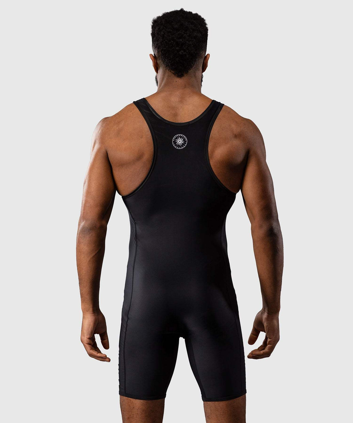 Combinaison de lutte Venum homme noire en tissu compressif extensible pour entraînement et compétition