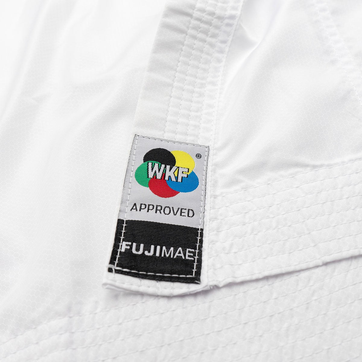 White FUJIMAE Kumite ProWear Hyperlite karate gi with WKF approved label for professional karatékas