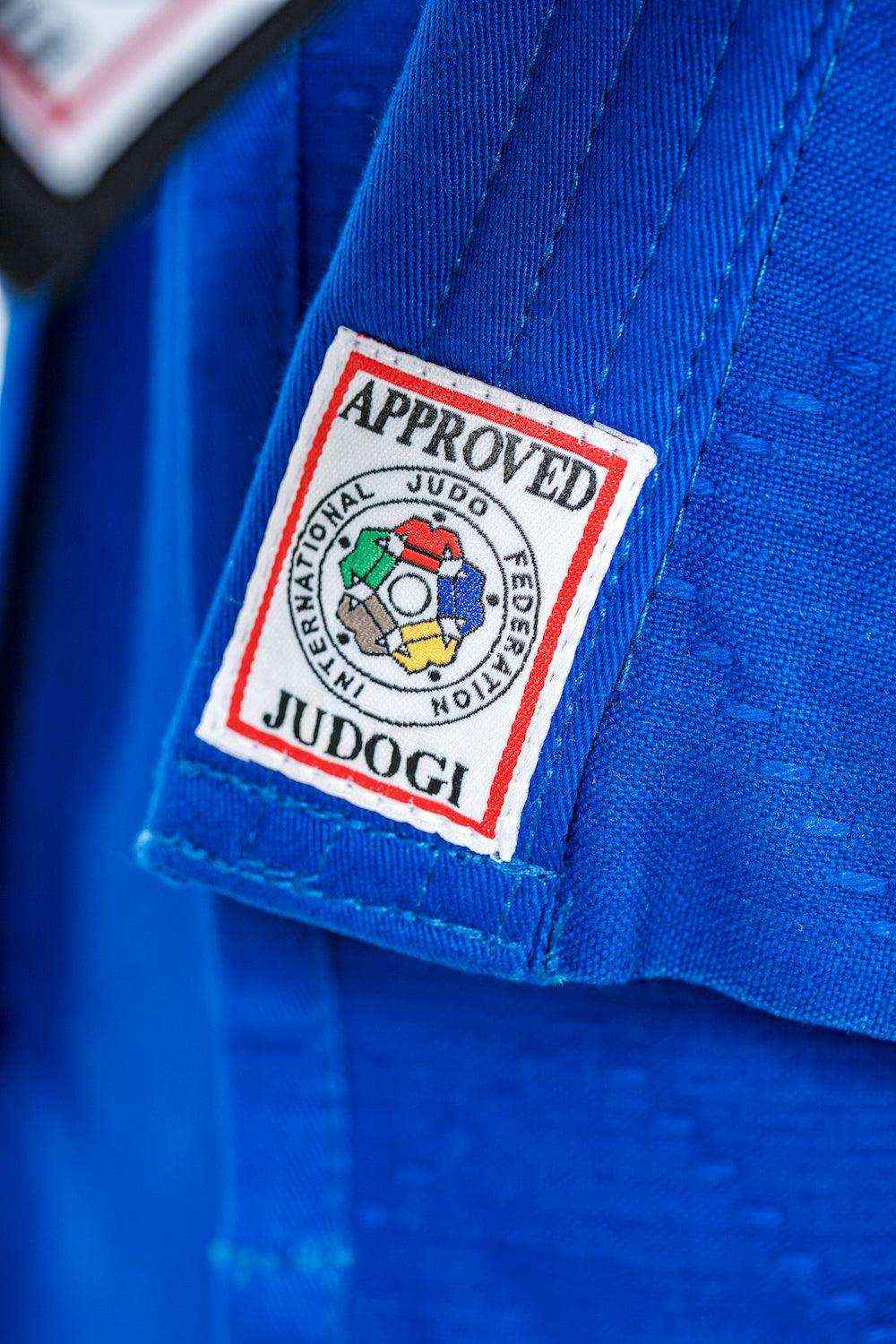 Close-up of blue Kimono Judo Mizuno Yusho IJF 2023 with official International Judo Federation approved Judogi patch.